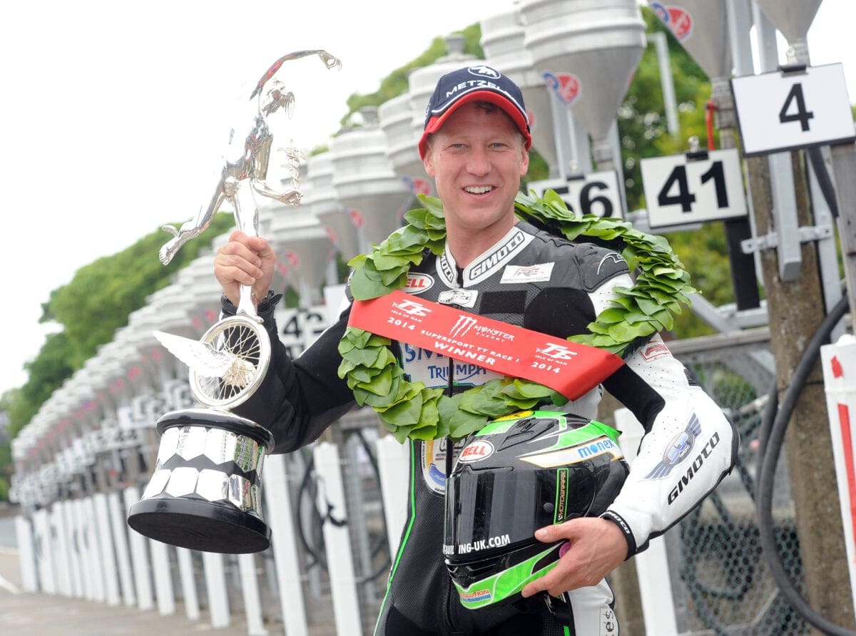 PACEMAKER BELFAST 02/06/2014: Gary Johnson (Smiths Triumph) celebrates after winning the Monster Energy Supersport race one the race at the 2014 Isle of Man TT