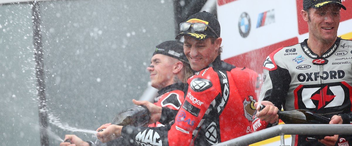 Josh Brookes stands at the top of the podium after race two of the British Superbikes Championship at Brands Hatch.