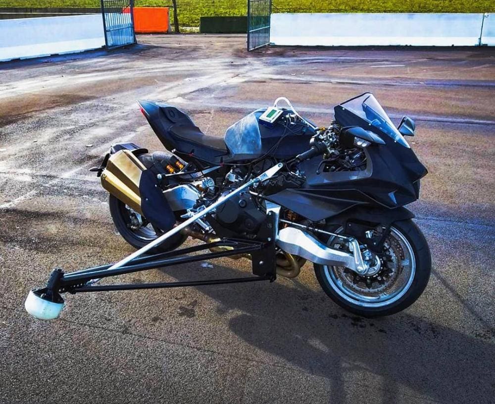 The outrigger arms will either catch you when the front wheel washes out or help you get into some serious slides on a slippery surface. Whichever the Bimota Tesi/Kawasaki H2 needs at the time, there's no getting away from the fact that this is very serious machine indeed. And someone at Bimota is really putting it through its paces... 