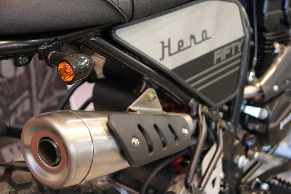 The detailing on the motorcycle, especially around the exhaust and bodywork, is spot on.
