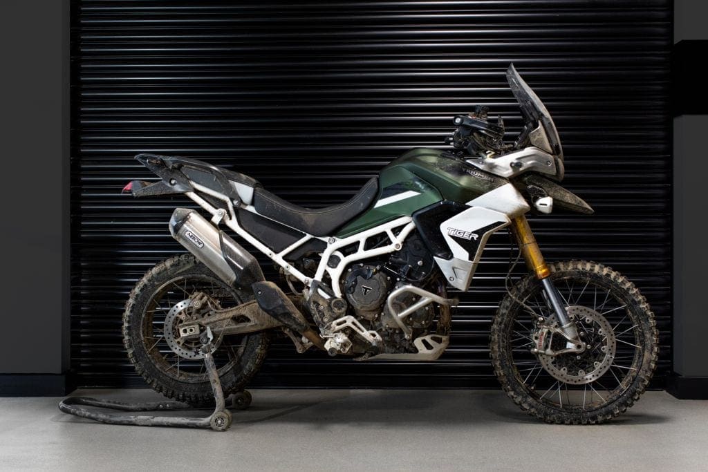 One of the Triumph Tiger 900s used in the film. Bit messy. Needs a clean.