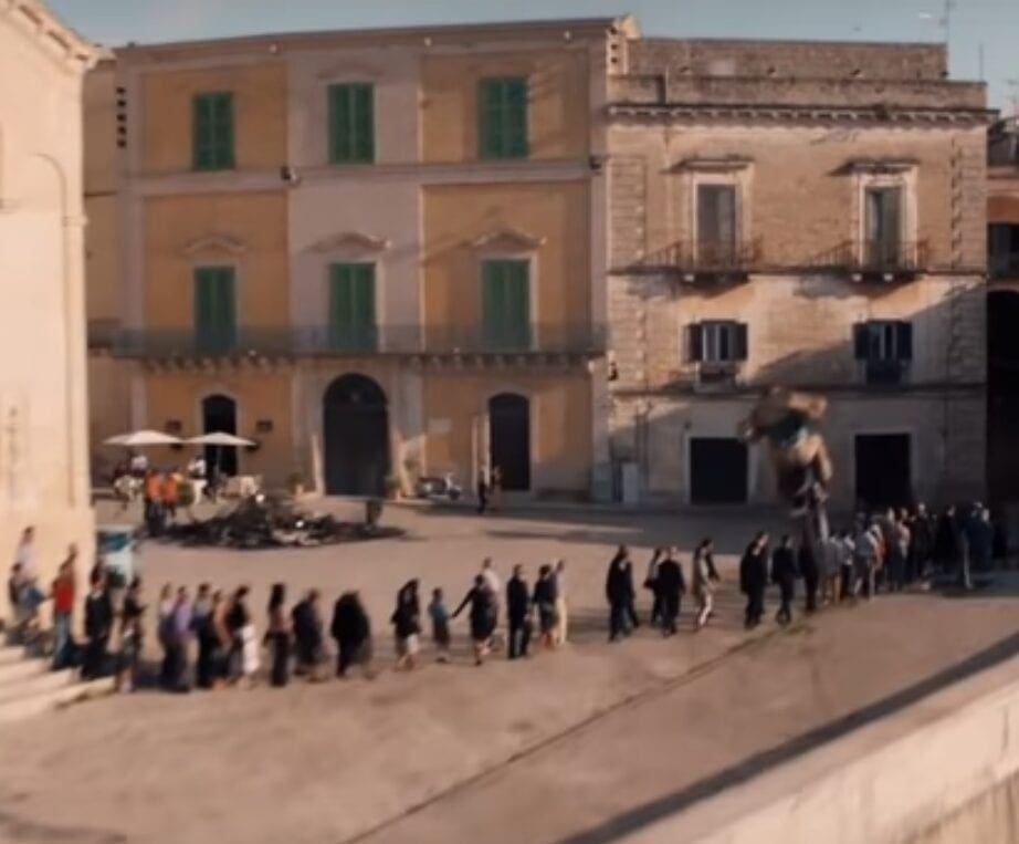 And he clears the wall. Almost spot on for the old-tyre-mark landing strip you can just make out where the stuntman has done this a time or two before. Amazing bit of skill. 