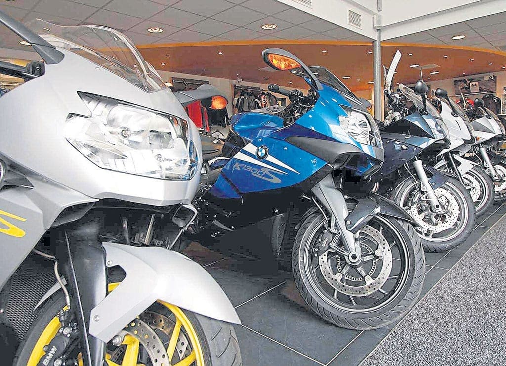 Budgeting for a bike. A row of motorcycles in a bike shop.