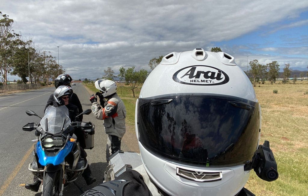 Long way 1 One of the group takes a selfie with their bike helmet on.