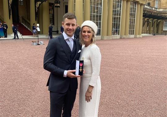 Jonathan Rea collects OBE with wife Tatia