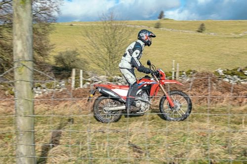 Side shot of a road bike going off-road