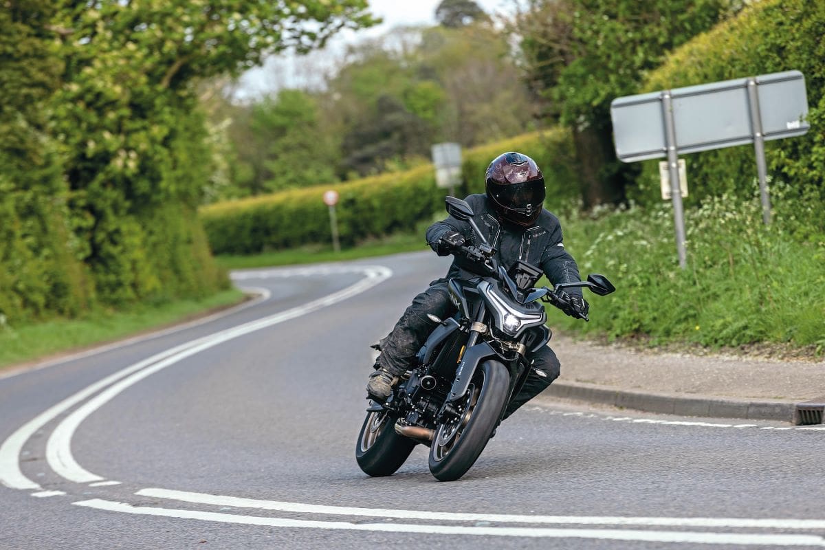 Around a bend in the road on a CFMOTO 800NK Advanced